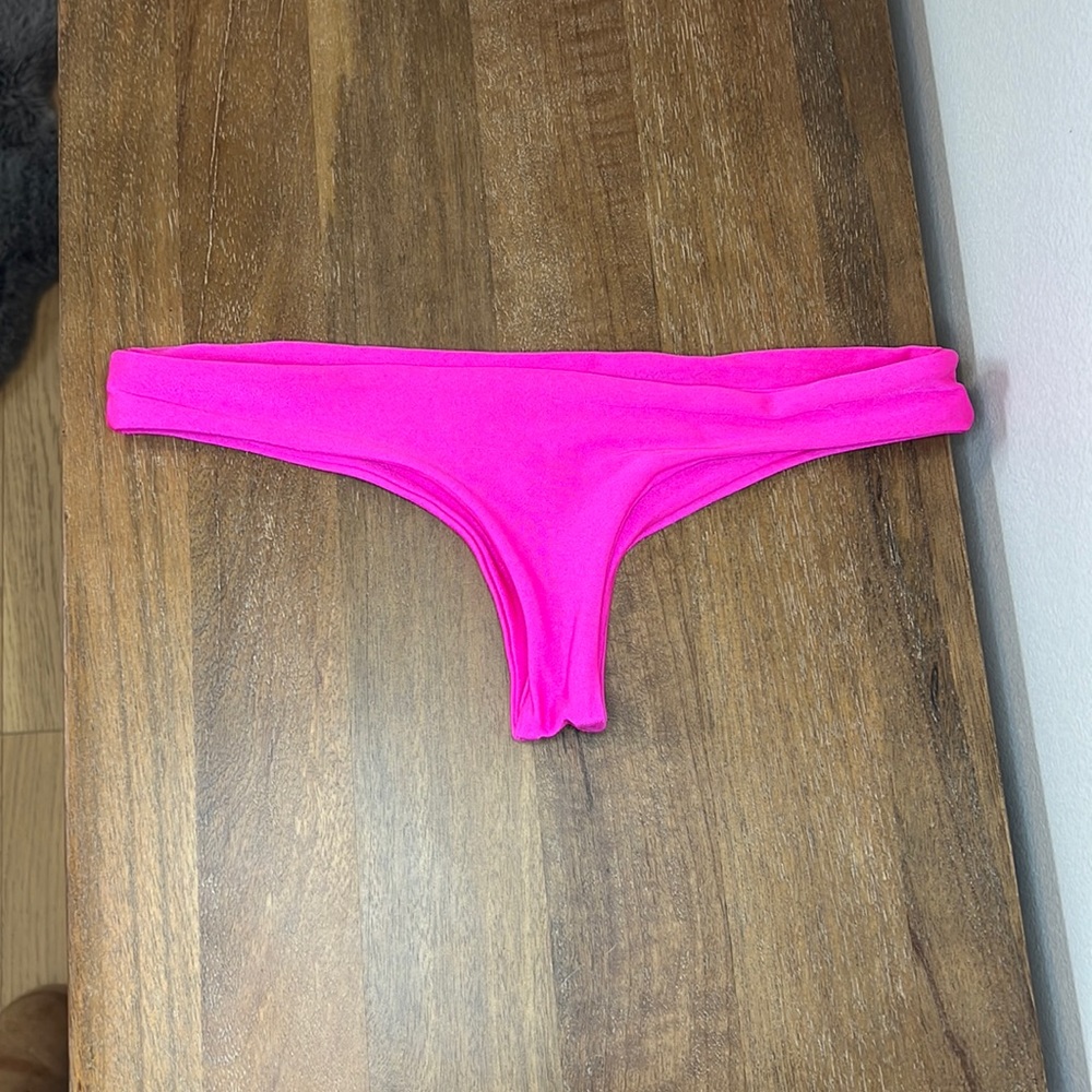 Luli Fama. Hot pink bikini bottoms. Used once. As is. Minimal coverage. Size s